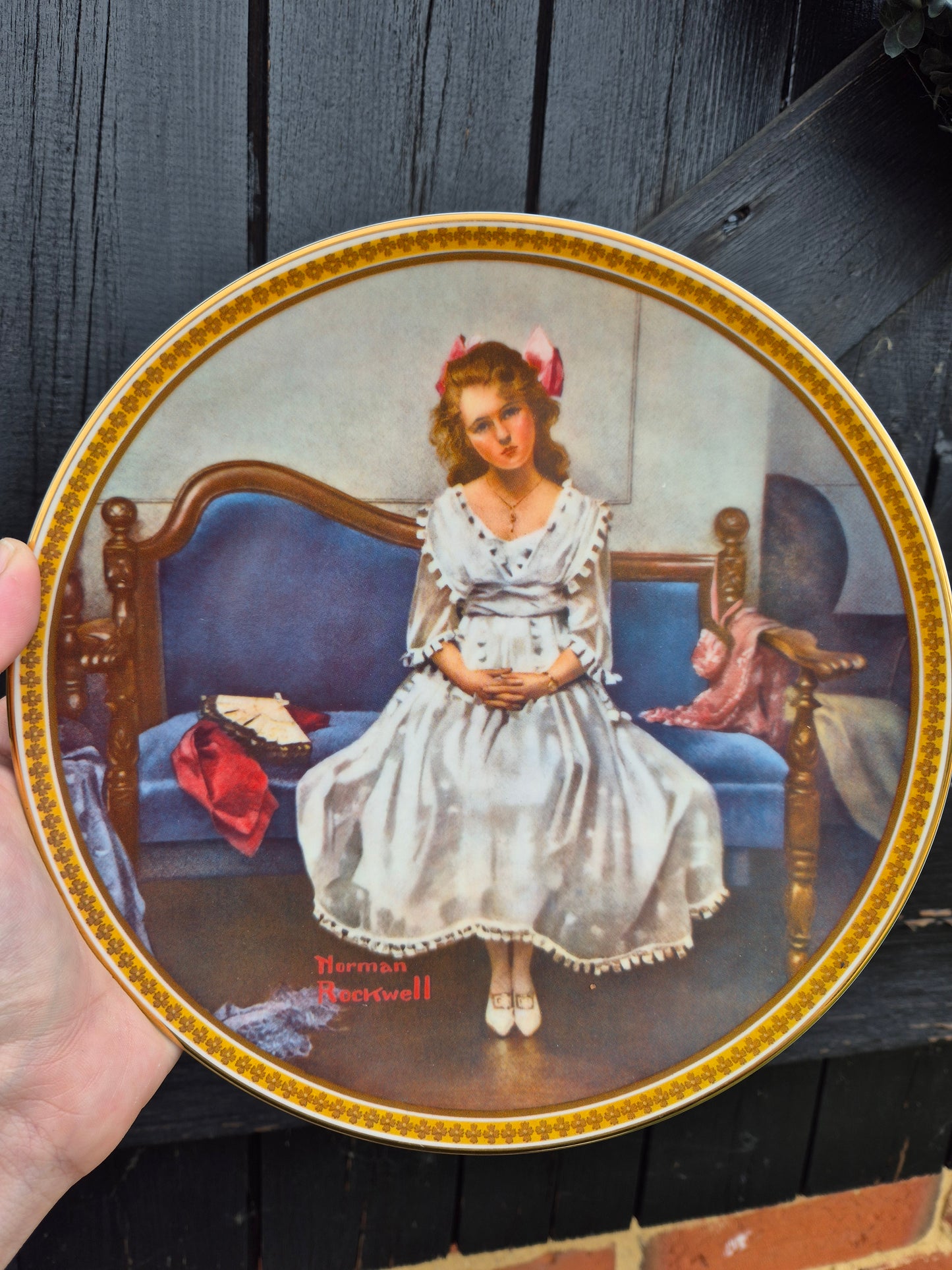 Lady sitting on couch plate