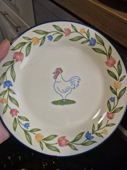 Cock plate