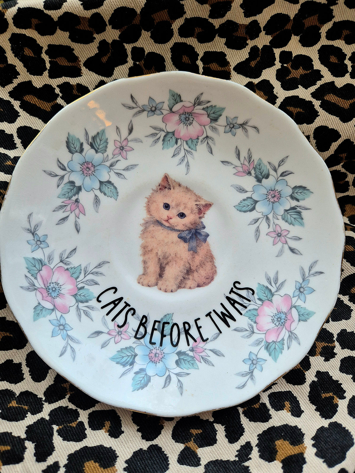 Cats before twats saucer