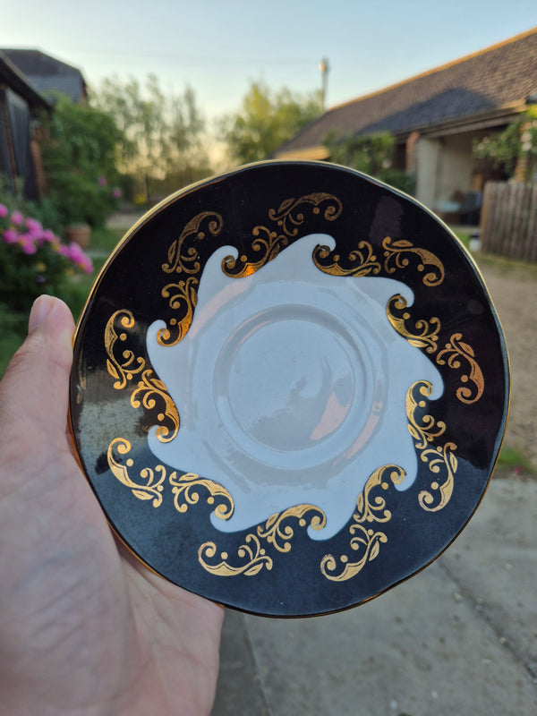 Black and gold saucer