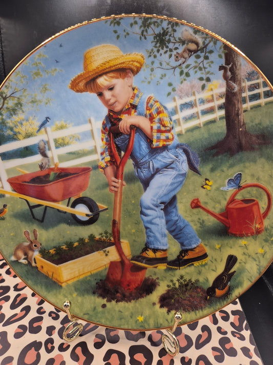 Boy digging a hole plate