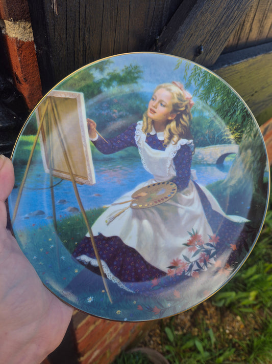 Girl painting plate