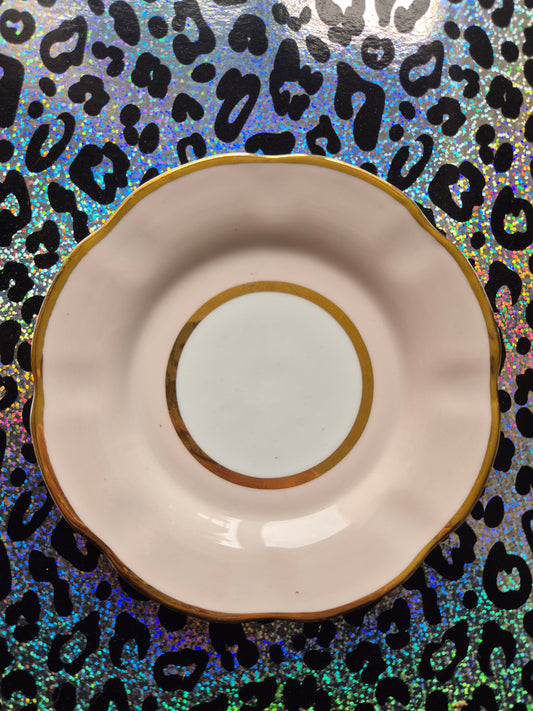 Pink and gold side plate