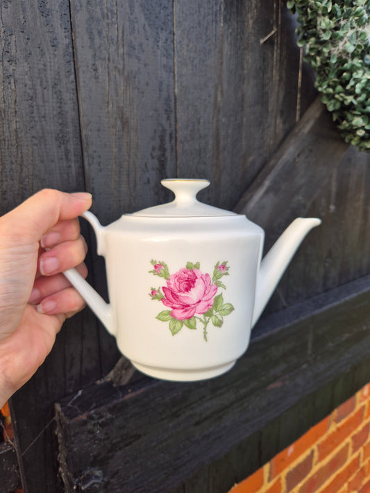 Small white teapot with pink rose