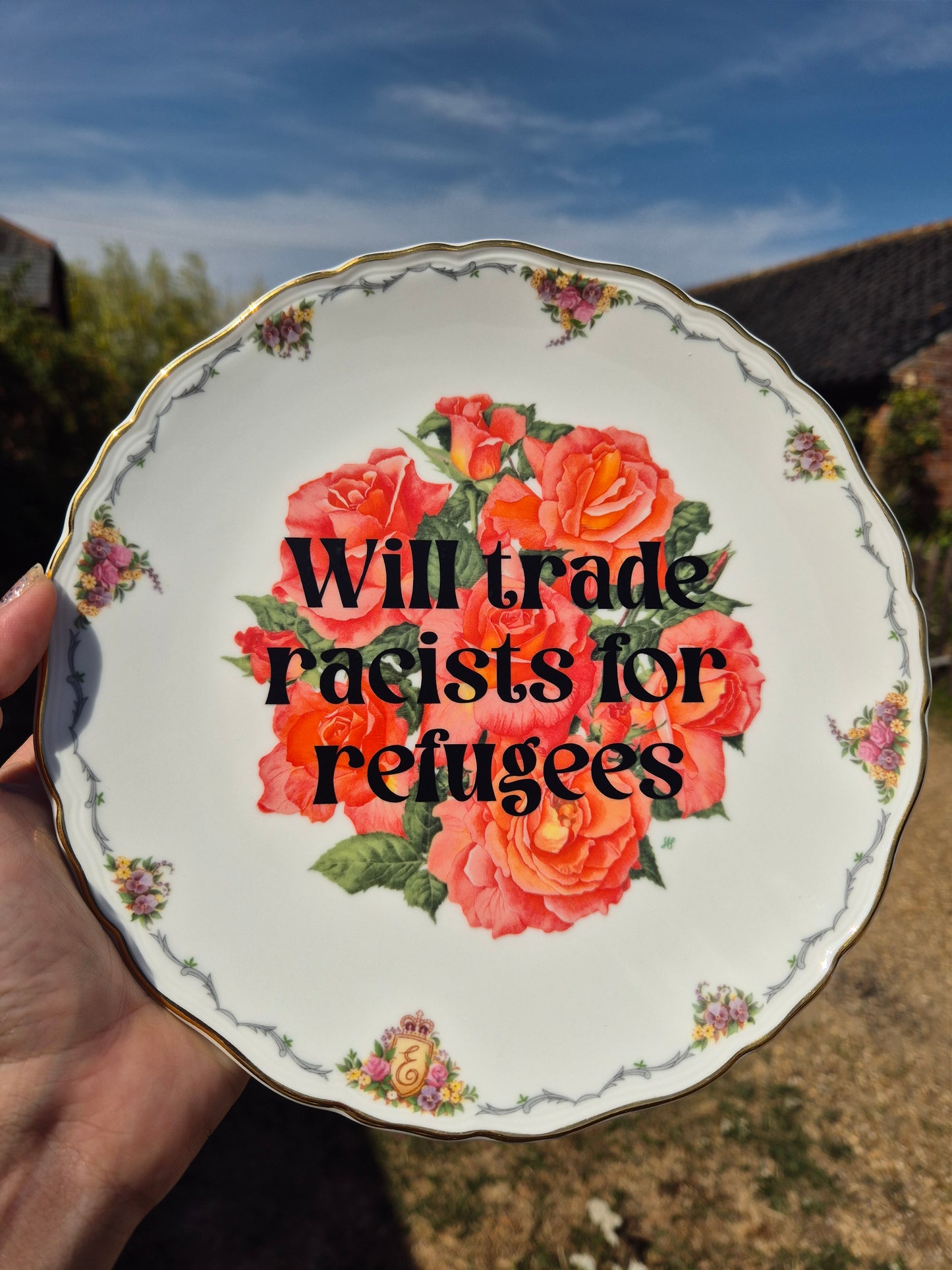Will trade racists for refugees floral plate