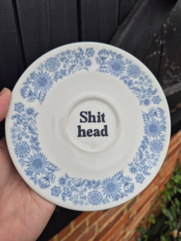 Shit head saucer