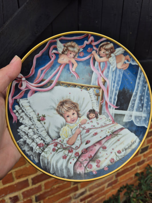 Child with angels plate