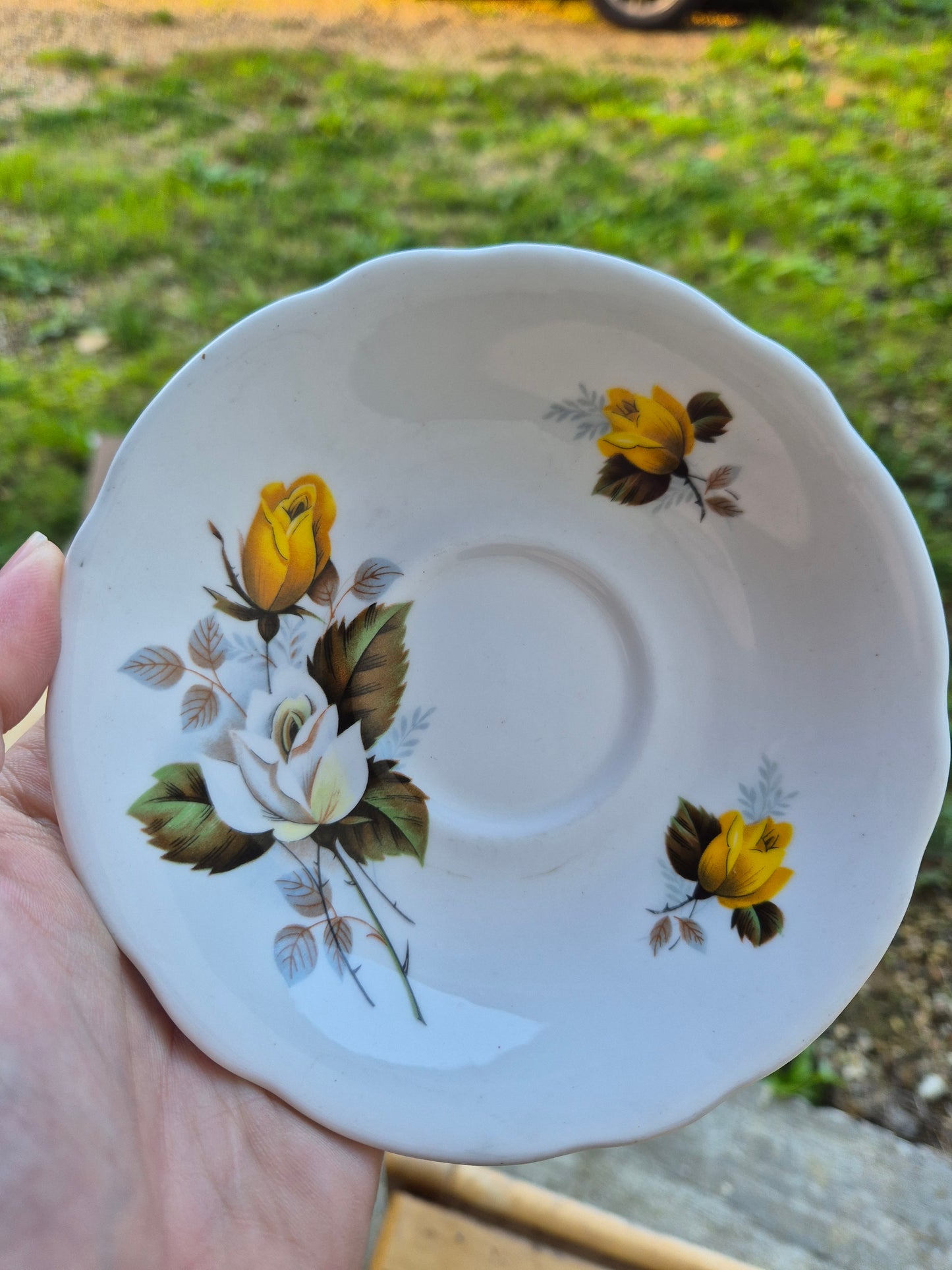 Yellow and white floral saucer