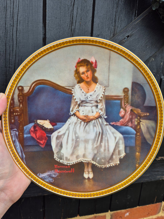 Lady sitting on couch plate